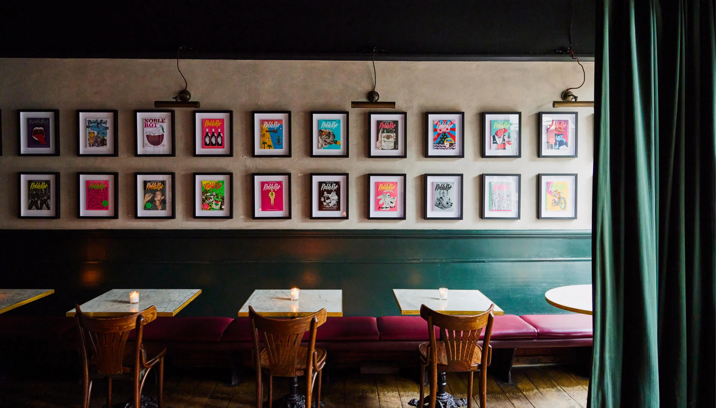 Magazine covers lining the wall at Noble Rot Lambs Conduit